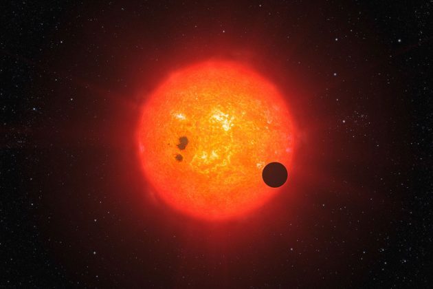Symbolbild: Künstlerische Darstellung eines Planeten um einen Roten Zwergstern (Illu.). Copyright: ESO/L. Calçada