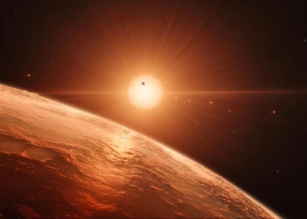 Künstlerische Darstellung, kein Foto: der rote Zwergstern TRAPPIST-1 und seine sieben Planeten. Copyright: ESO
